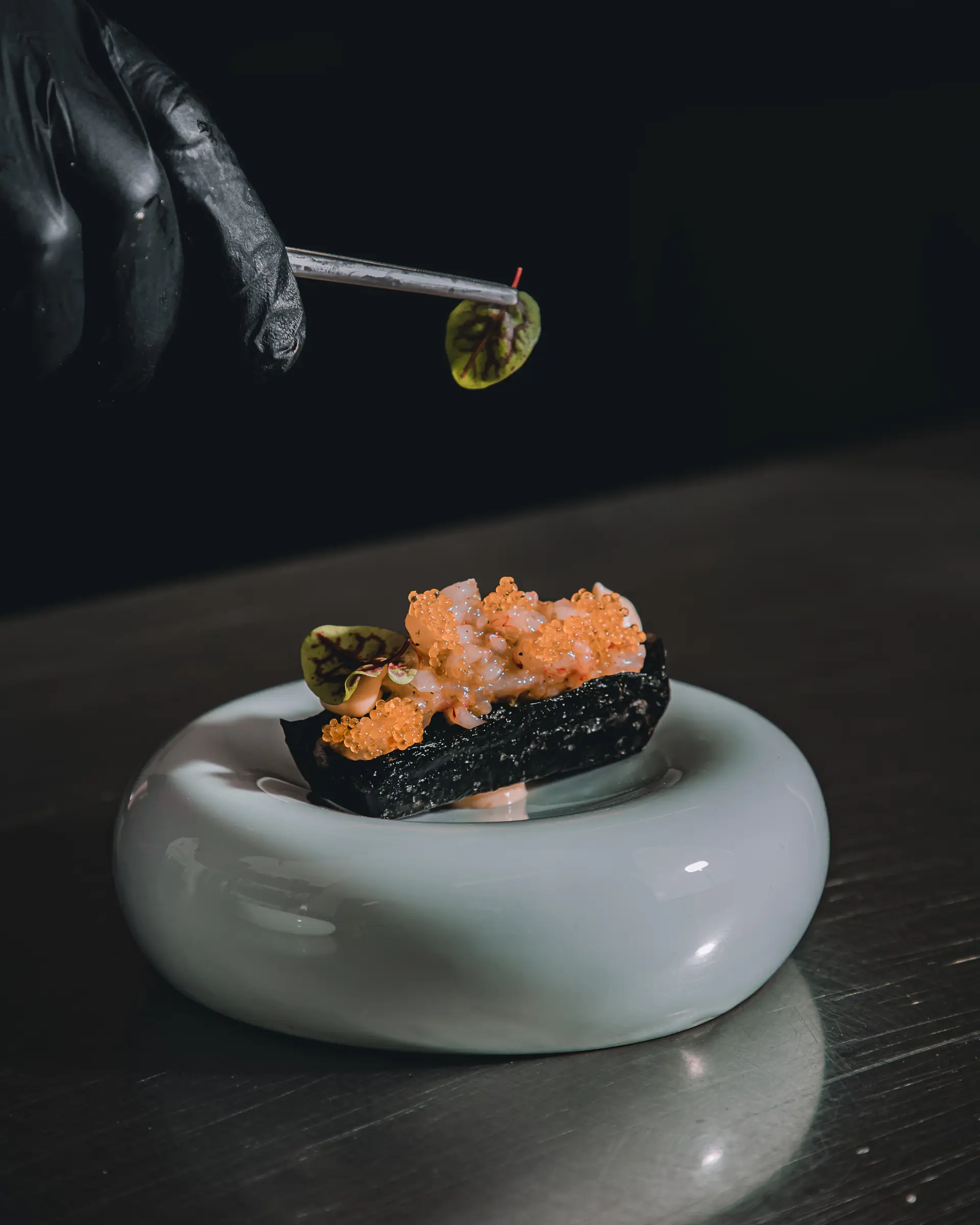 Chef precision plating fresh Australian seafood